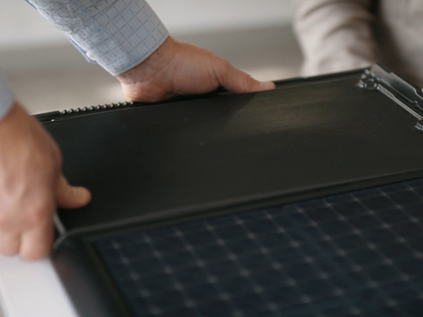 Volt solar tile beside a standard roof tile